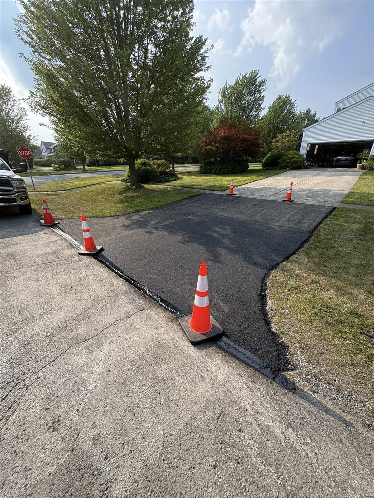 Asphalt sealcoating